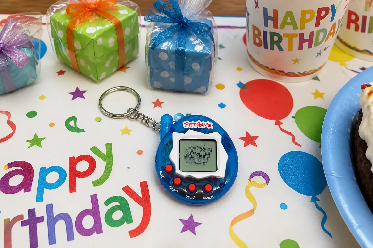 A virtual pet keychain clipped to a backpack